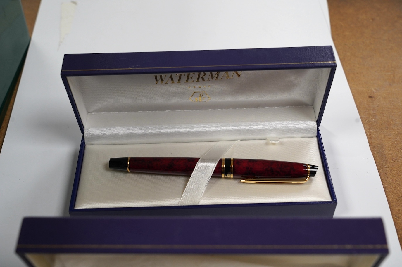 A silver mounted Sheaffer fountain pen, two cased Waterman fountain pens, a ballpoint pen branded for Boeing, and a Queen Elizabeth II pen and cufflink set. Condition - fair to good